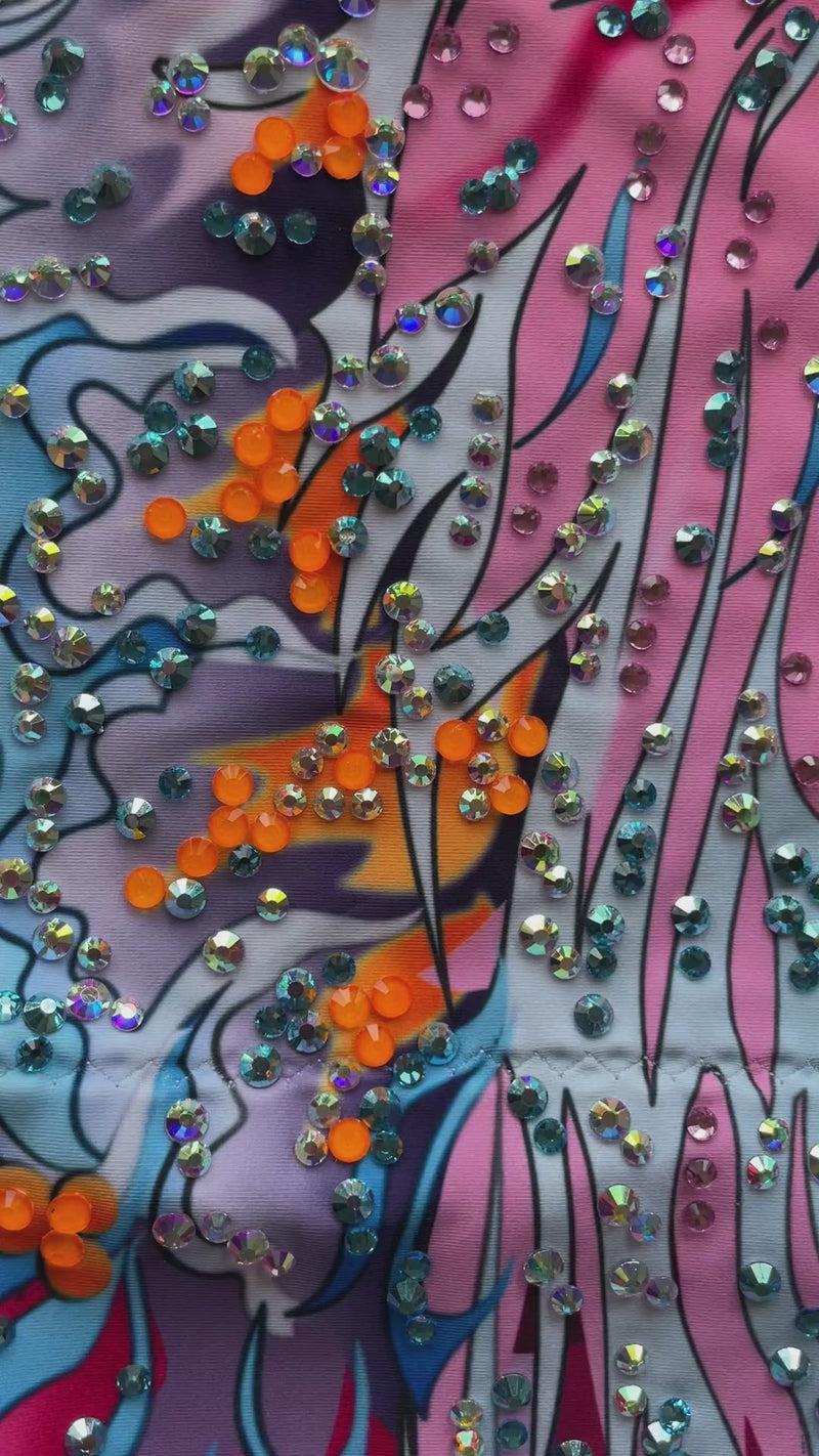 Maillot profesional elástico con falda de picos degradada y brillantes multicolores.