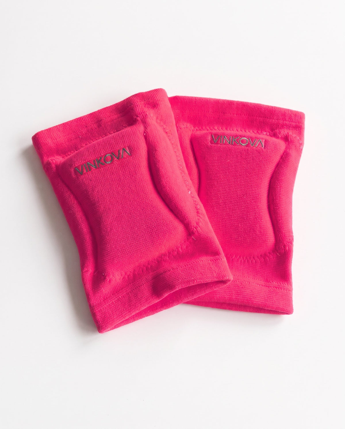 Paio di ginocchiere da ginnastica ritmica Vinkova, colore rosa fluo, con imbottitura e logo